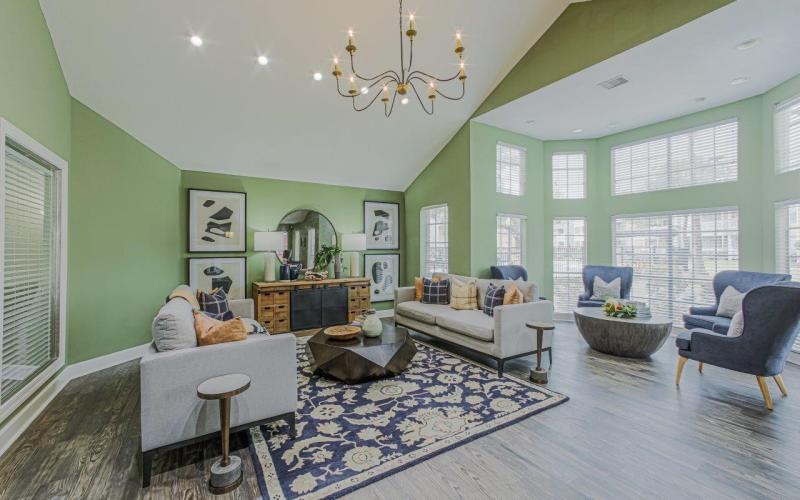 a living room with a chandelier and a couch