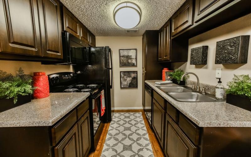 a kitchen with black appliances